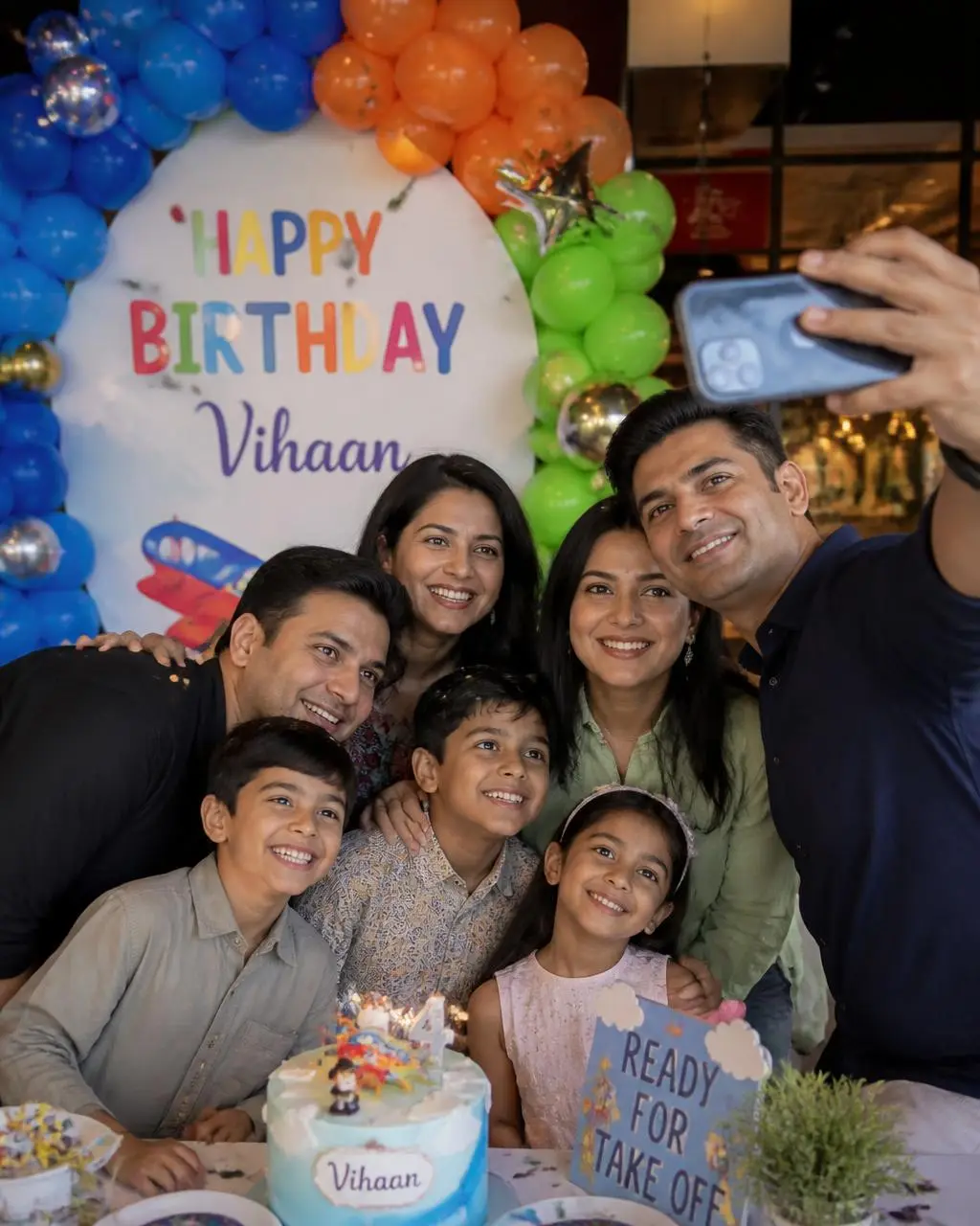Kids birthday selfie with balloon backdrop