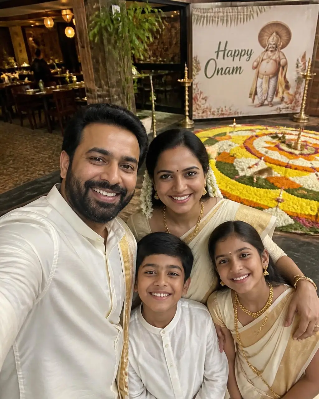 Onam family selfie with floral decor